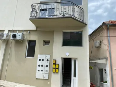 a building with a balcony on top of it at Studio Milica in Soko Banja