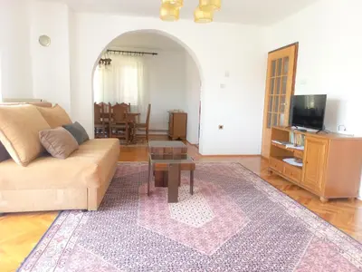 a living room with a couch and a table at Vila Nikola in Soko Banja