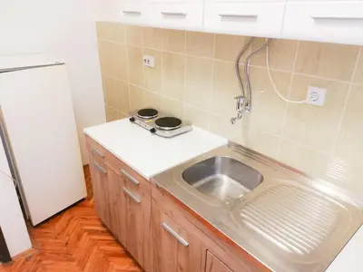 a kitchen with a sink and a counter at Vila Nikola in Soko Banja