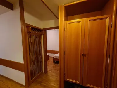 a hallway with an open door to a bedroom at Apartman 602 in Kopaonik