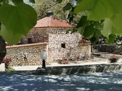 an old stone building with a stone wall at Apartman ST.Nedeljkovic Sokobanja in Soko Banja