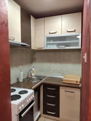 a kitchen with a stove and a sink at Modern cozy apartment in Niš