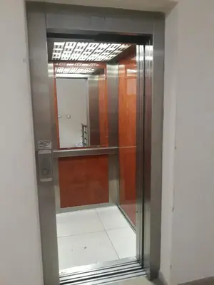 a glass door in a room with a mirror at Studio City day in Jagodina
