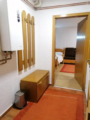 a room with a door leading to a room with a bedroom at Guest House Villa Rankovic in Brzeće