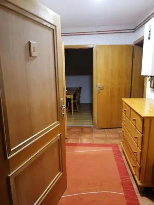 an open door to a room with a kitchen and a table at Guest House Villa Rankovic in Brzeće