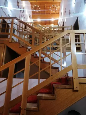 an overhead view of a wooden spiral staircase at Guest House Villa Rankovic in Brzeće