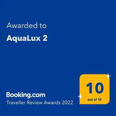 a yellow box with the text awarded to aquarius at AquaLux 2 in Soko Banja
