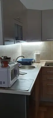 a kitchen with a microwave on a counter at Apartman TIM LUX 1 in Vrnjačka Banja