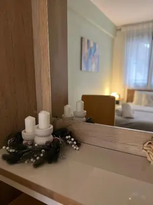 a room with a mirror and candles on a counter at Enigma in Vrnjačka Banja