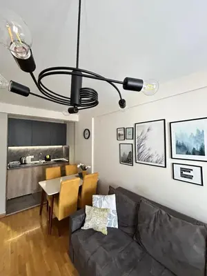 a living room with a couch and a table at Enigma in Vrnjačka Banja
