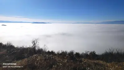 a view of a field of fog in the ocean at President Kop - Apartman A21 in Kopaonik