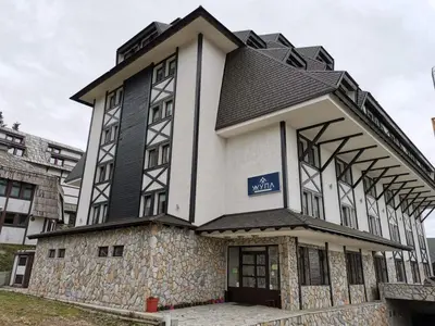 a building with a black and white at Central Residence by Župa in Kopaonik