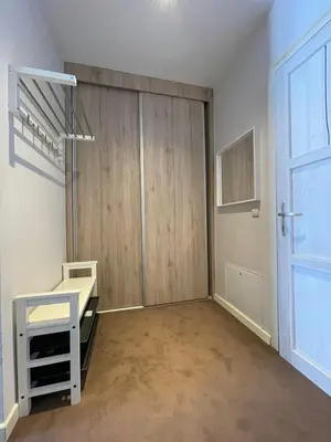 a room with a closet with a desk and a door at Central Residence by Župa in Kopaonik