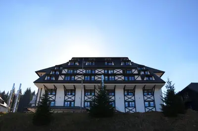 a large white building with a lot of windows at Central Residence by Župa in Kopaonik