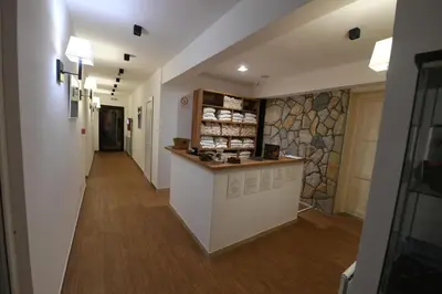 a hallway of a pharmacy with a counter in a building at Central Residence by Župa in Kopaonik