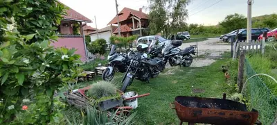 a motorcycle parked in the yard of a house at Stancic 019 in Zaječar