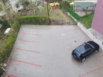 an overhead view of a car parked in a parking lot at Nina Apartman in Soko Banja