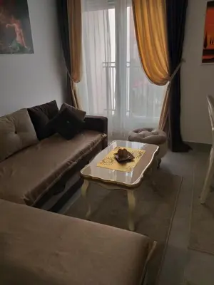 a living room with a couch and a coffee table at Apartmani Soko Day 1 in Soko Banja