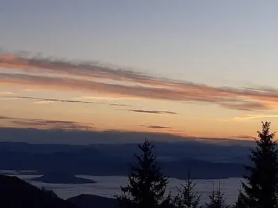 a view of a sunset from the top of a mountain at Vikend kuća Čairović in Kopaonik