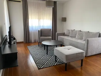 a living room with a couch and a table at Apartman Luka in Vrnjačka Banja