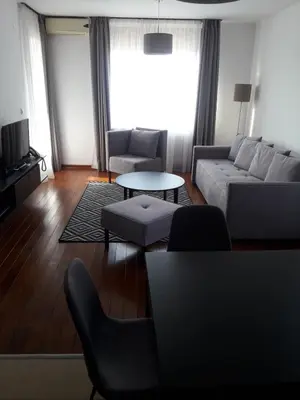 a living room with a couch and a table at Apartman Luka in Vrnjačka Banja