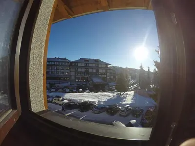 a view from a window of a building with snow at Apartman A7 u vili Pahulja in Kopaonik