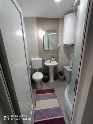 a small bathroom with a toilet and a sink at Apartman Sunce in Soko Banja