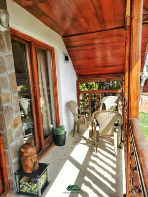 a porch of a house with a wooden ceiling at Villa Balconlux - Zavojsko jezero, Pirot in Pirot