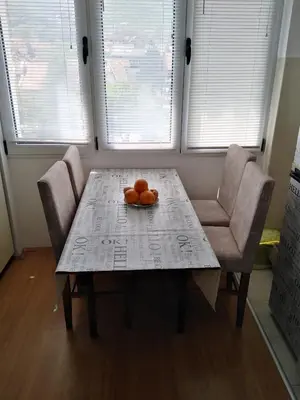 a table with two oranges sitting on top of it at Rudolf apartmani in Soko Banja