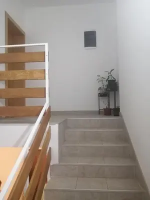 a staircase in a room with white walls at Apartman Daša in Soko Banja