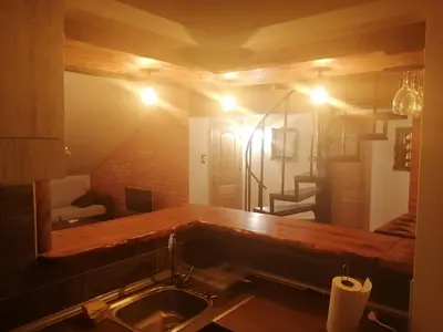 a kitchen with a sink and a counter with a mirror at Apartman Daša in Soko Banja