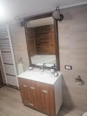 a bathroom with a sink and a mirror at Apartman Daša in Soko Banja