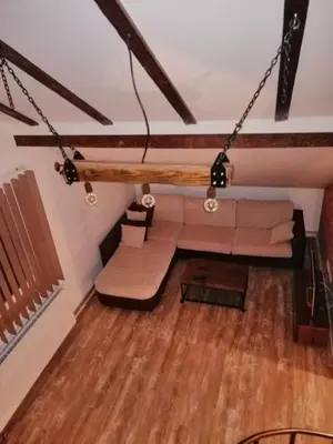 a living room with a couch and a table at Apartman Daša in Soko Banja