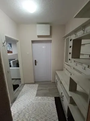 a large bathroom with a sink and a door at Stan na dan in Aleksinac