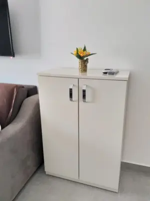 a white cabinet with a vase on top of it at Studio Soko Day 2 in Soko Banja