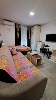 a large room with two beds and a kitchen at Studio Soko Day 2 in Soko Banja