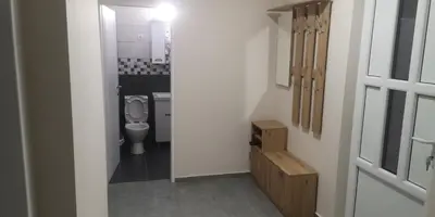 a small bathroom with a toilet in a room at Sokobanja apartman Aviva in Soko Banja