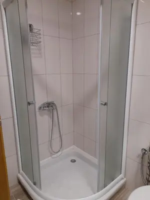 a shower with a glass door in a bathroom at Lena7 in Vrnjačka Banja