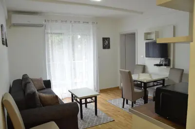 a living room with a couch and a table at Apartman Rajak in Vrnjačka Banja