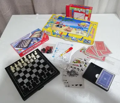 a table with a chess board and other games on it at Apartman Nana Jagodina in Jagodina
