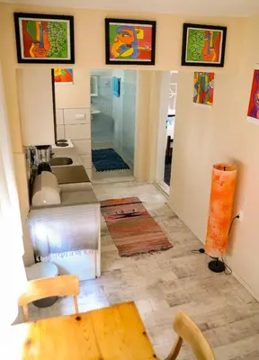 a bathroom with a sink and a toilet in a room at Kuća za odmor Apartman Solo in Soko Banja