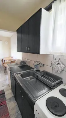 a kitchen with a sink and a counter top at Kuća za odmor Apartman Solo in Soko Banja