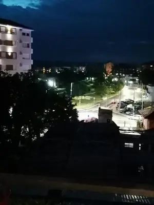 a view of a parking lot at night at Emili Apartman in Jagodina