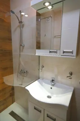 a bathroom with a white sink and a mirror at Apartman Alegro in Soko Banja