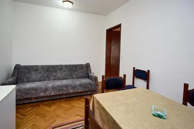 a living room with a couch and a table at Apartmani Dr. Gaša in Soko Banja
