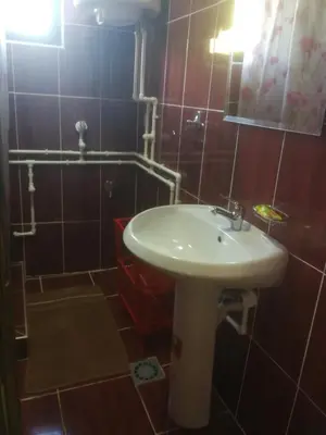 a bathroom with a sink and a mirror at Odmaralište Vlaško ždrelo in Pirot