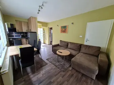 a living room with a couch and a table at Apartman Boskovic in Soko Banja