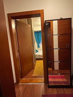 a door leading into a room with a hallway at Una in Vrnjačka Banja