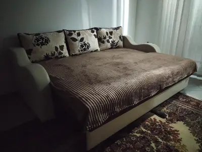 a bed with two pillows on it in a room at Apartman Todorovic in Jagodina