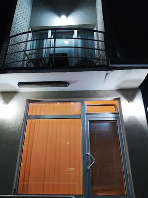 a pair of doors on a building with a balcony at Apartman Todorovic in Jagodina